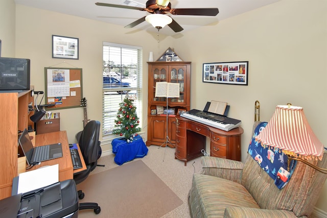 office area with carpet and ceiling fan