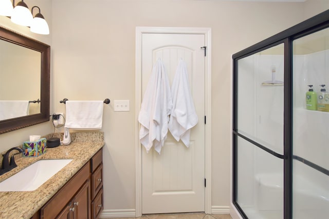 bathroom with vanity and walk in shower