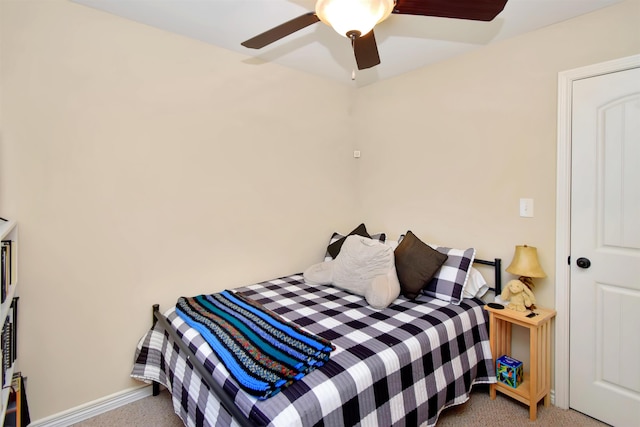 bedroom with ceiling fan and light colored carpet