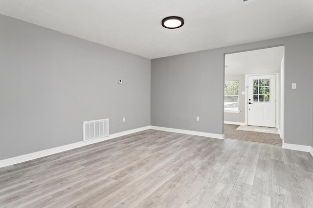590 Parks St, Silsbee, TX 77656 - unfurnished room featuring baseboards, light wood-style floors, and visible vents