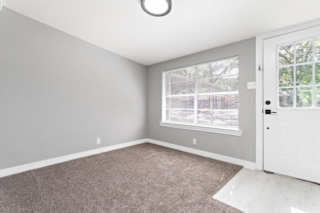 590 Parks St, Silsbee, TX 77656 - carpeted foyer featuring baseboards