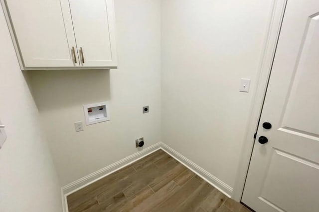 1585 Little Cypress Loop, Orange, TX 77632 - laundry room featuring hookup for an electric dryer, hookup for a washing machine, dark wood finished floors, and cabinet space