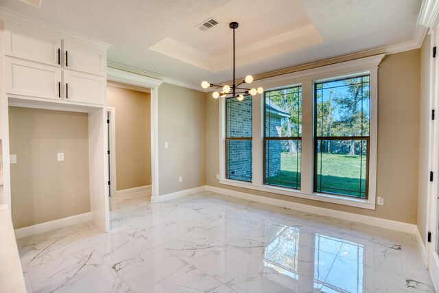 unfurnished dining area with a raised ceiling, ornamental molding, and a chandelier