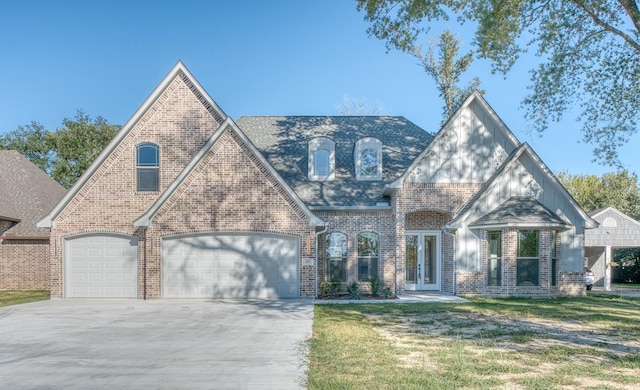 view of front facade featuring driveway, brick siding, a front lawn, and an attached garage