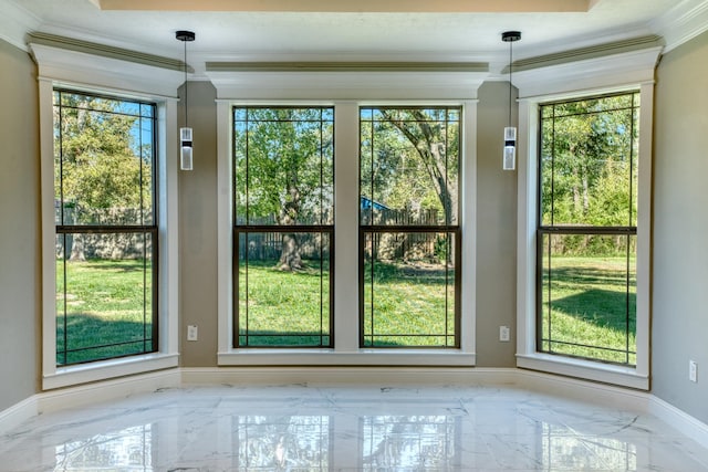 doorway with marble finish floor, crown molding, and baseboards