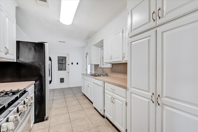 kitchen with dishwasher, stainless steel gas range, white cabinetry, and sink