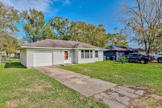 ranch-style house featuring a garage and a front lawn