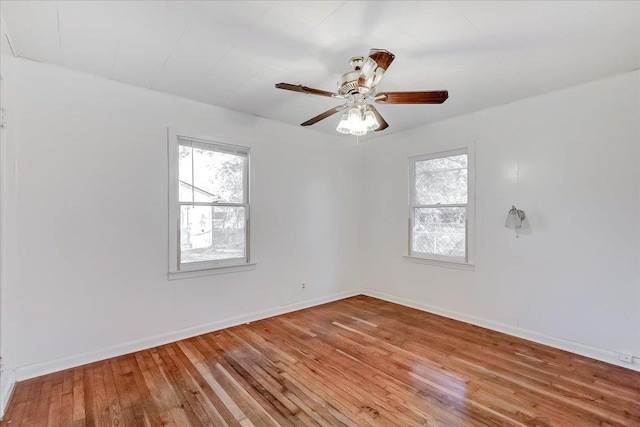 empty room featuring hardwood / wood-style flooring and ceiling fan