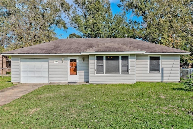 ranch-style house with a front yard and a garage