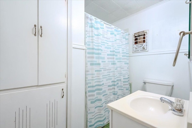 bathroom featuring vanity, toilet, walk in shower, and ornamental molding