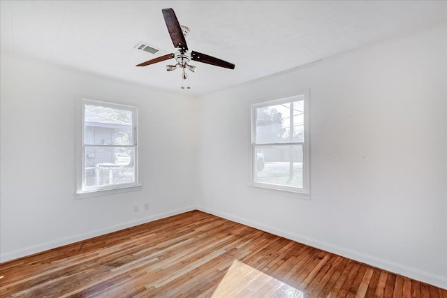 unfurnished room with ceiling fan and light wood-type flooring