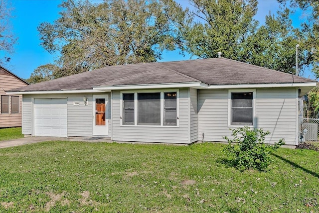 ranch-style house with a front yard and a garage