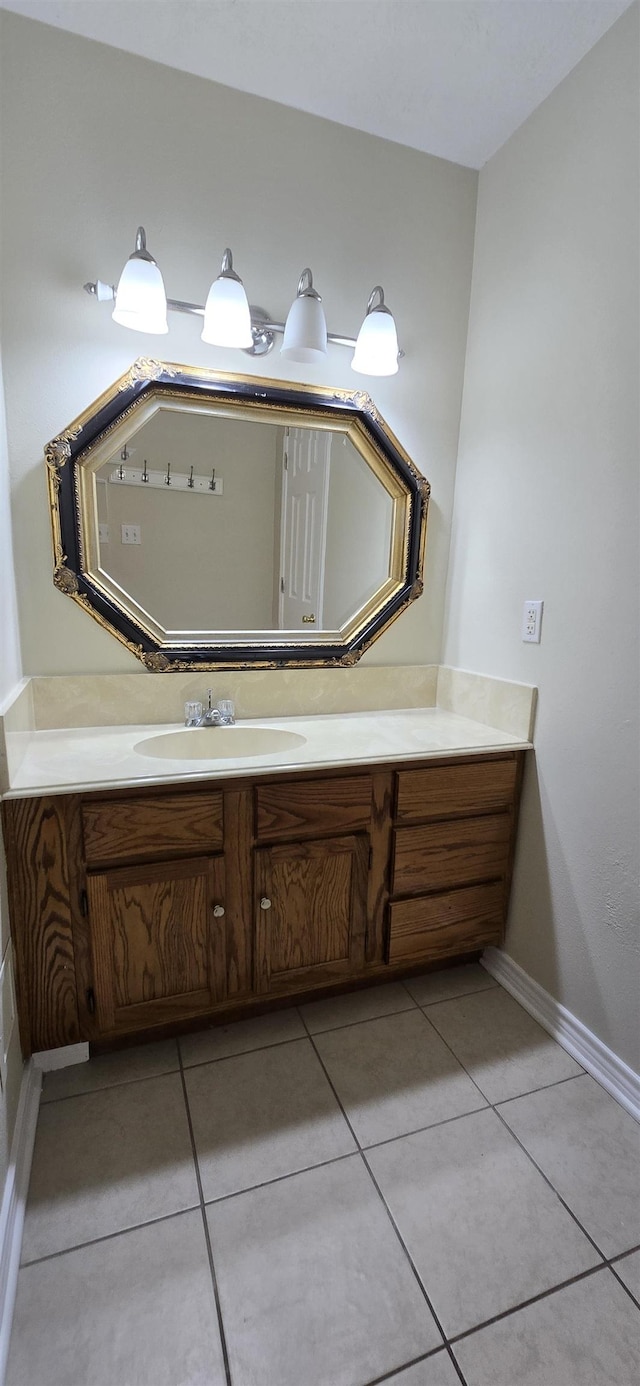 bathroom featuring tile patterned flooring and vanity