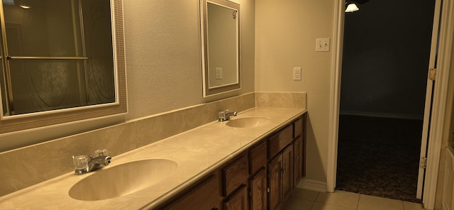 bathroom with tile patterned floors and vanity