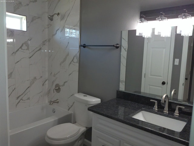 full bathroom with vanity, toilet, and tiled shower / bath combo