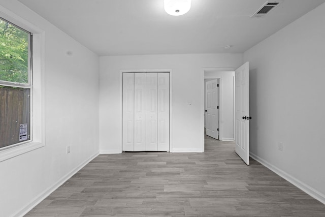 4247 Lansing Ave, Port Arthur, TX 77642 - unfurnished bedroom with wood finished floors and a closet