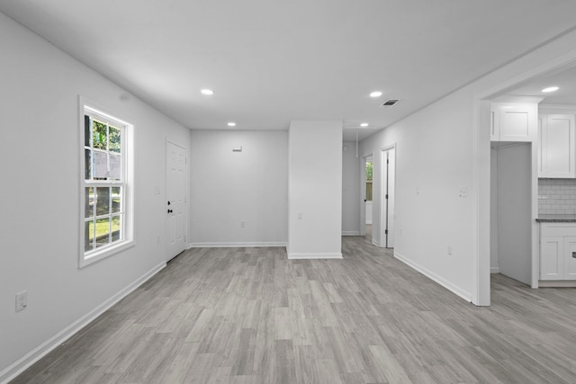 4247 Lansing Ave, Port Arthur, TX 77642 - unfurnished living room with recessed lighting and light wood finished floors