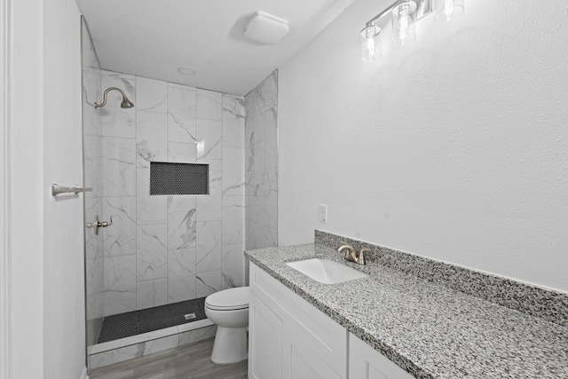 4247 Lansing Ave, Port Arthur, TX 77642 - full bath featuring vanity, a tile shower, and wood finished floors