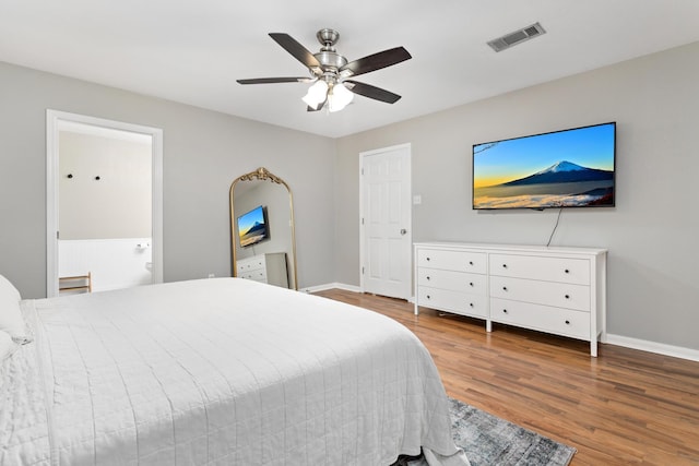 7669 Boardwalk, Lumberton, TX 77657 - bedroom featuring wood finished floors, baseboards, ceiling fan, and ensuite bath