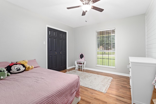 7669 Boardwalk, Lumberton, TX 77657 - bedroom featuring light wood finished floors, baseboards, a ceiling fan, and a closet