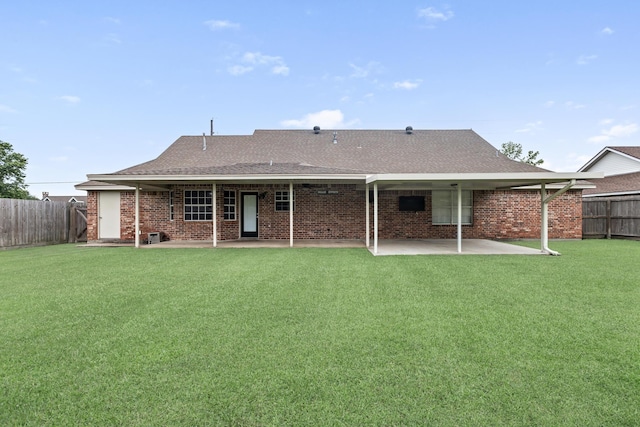 7669 Boardwalk, Lumberton, TX 77657 - rear view of house with a patio, brick siding, and a shingled roof