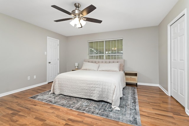 7669 Boardwalk, Lumberton, TX 77657 - bedroom with wood finished floors, baseboards, and a ceiling fan