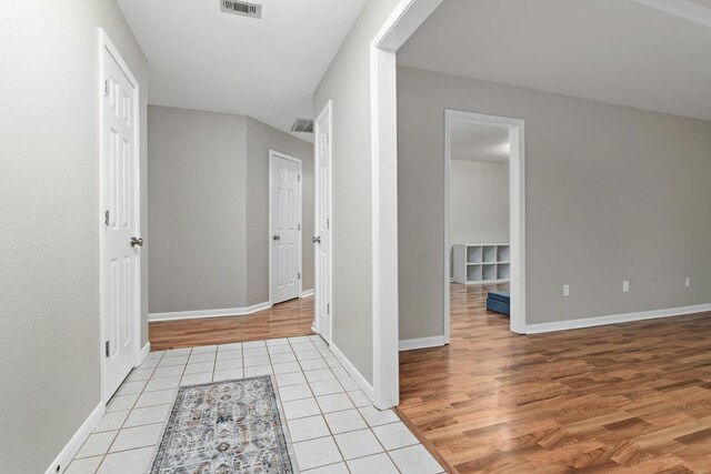 7669 Boardwalk, Lumberton, TX 77657 - hall featuring light tile patterned flooring and baseboards