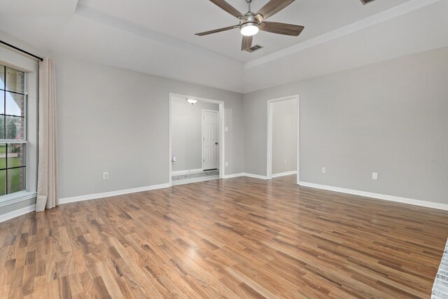 7669 Boardwalk, Lumberton, TX 77657 - spare room featuring ceiling fan, wood finished floors, and baseboards