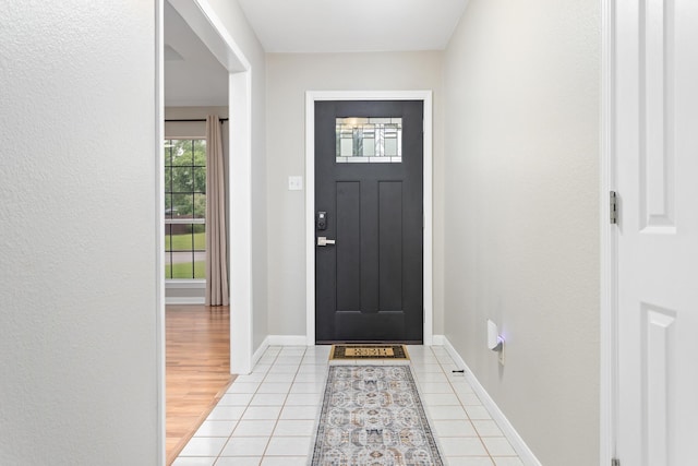 7669 Boardwalk, Lumberton, TX 77657 - foyer entrance featuring baseboards and light tile patterned flooring