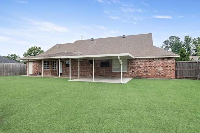 7669 Boardwalk, Lumberton, TX 77657 - back of house featuring a patio area, brick siding, and roof with shingles