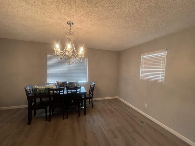 775 Todd St, Beaumont, TX 77707 - dining room with a chandelier, dark wood-type flooring, and a textured ceiling