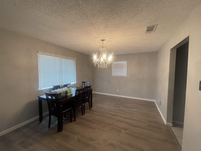 775 Todd St, Beaumont, TX 77707 - dining room with a chandelier, wood finished floors, and a textured ceiling