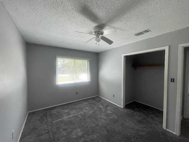 775 Todd St, Beaumont, TX 77707 - unfurnished bedroom featuring dark colored carpet, a textured ceiling, and ceiling fan