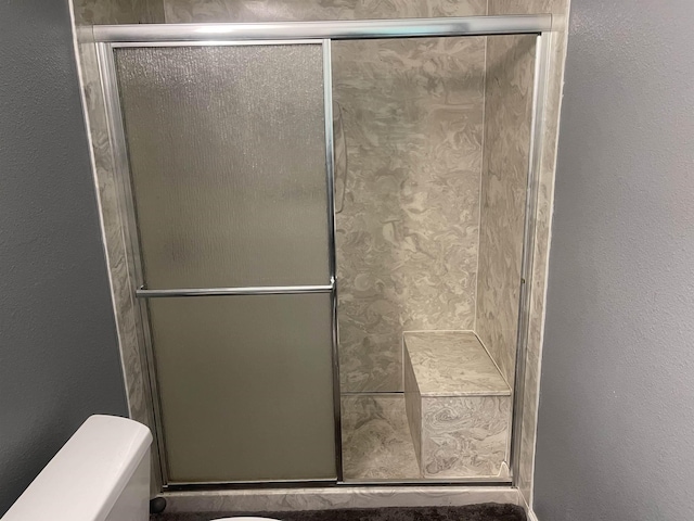 775 Todd St, Beaumont, TX 77707 - bathroom with a stall shower and a textured wall