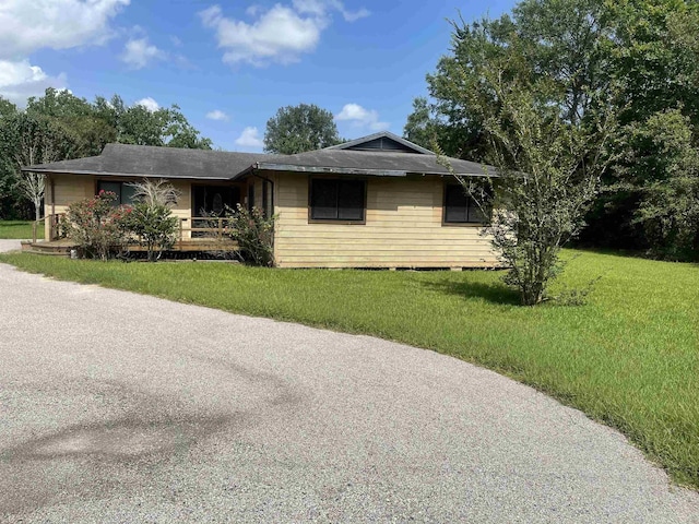 775 Todd St, Beaumont, TX 77707 - view of front of home with a front yard and a shingled roof
