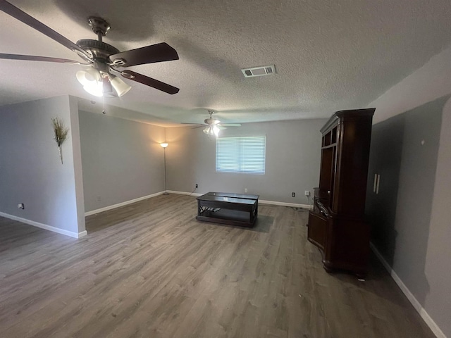 775 Todd St, Beaumont, TX 77707 - interior space featuring ceiling fan, wood finished floors, and a textured ceiling