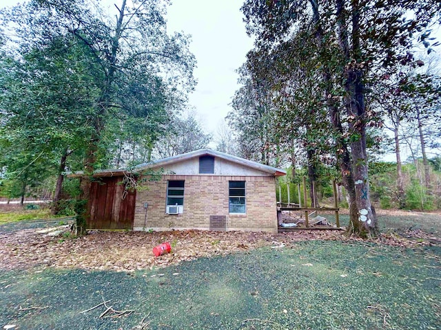 view of home's exterior with a yard and brick siding