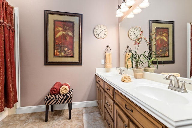 bathroom with tile patterned flooring and vanity