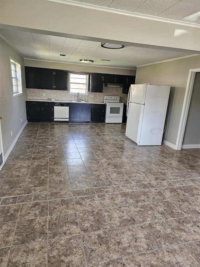 kitchen with sink, white appliances, and backsplash