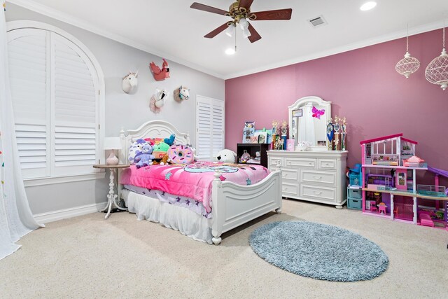 carpeted bedroom with ceiling fan and ornamental molding