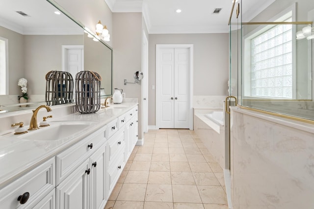 bathroom with vanity, ornamental molding, and tiled bath