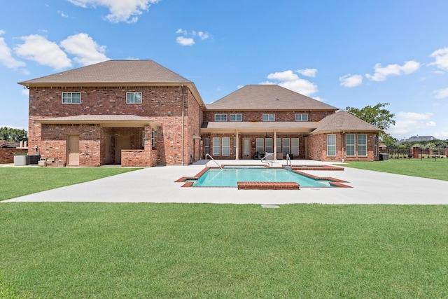 rear view of property featuring a lawn, a patio area, and central air condition unit