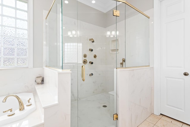 bathroom with shower with separate bathtub and crown molding