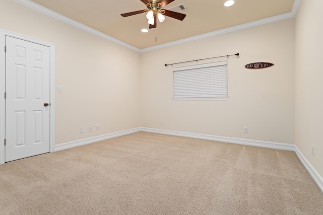 spare room featuring carpet, ceiling fan, and ornamental molding