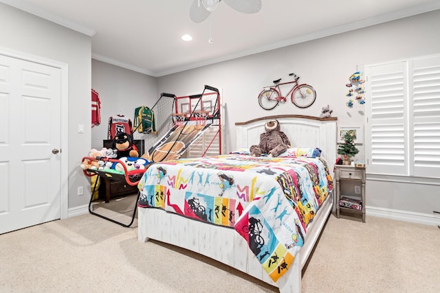 carpeted bedroom featuring ceiling fan and crown molding