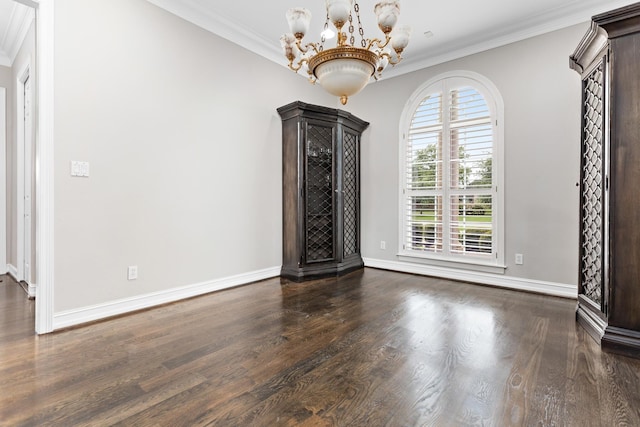 unfurnished living room featuring ornamental molding, dark hardwood / wood-style flooring, and a notable chandelier