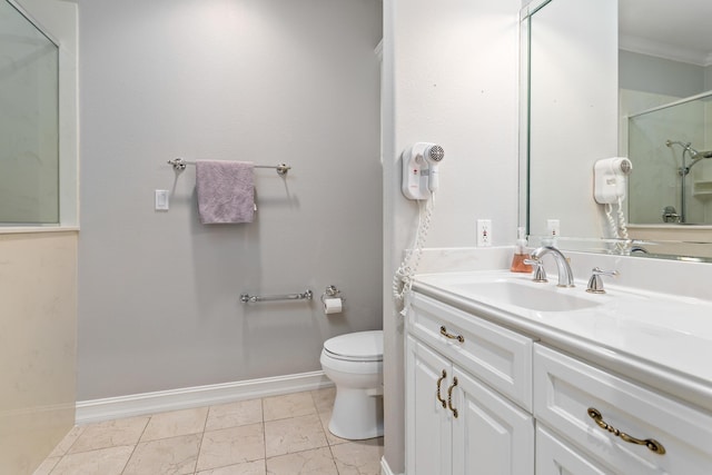 bathroom with an enclosed shower, vanity, toilet, and crown molding