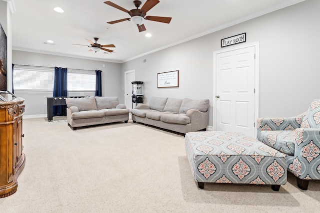 living room featuring ceiling fan, crown molding, and light carpet