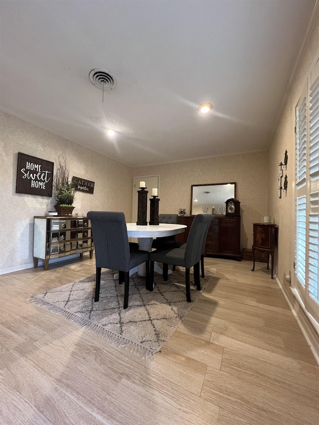 dining space with light wood-type flooring