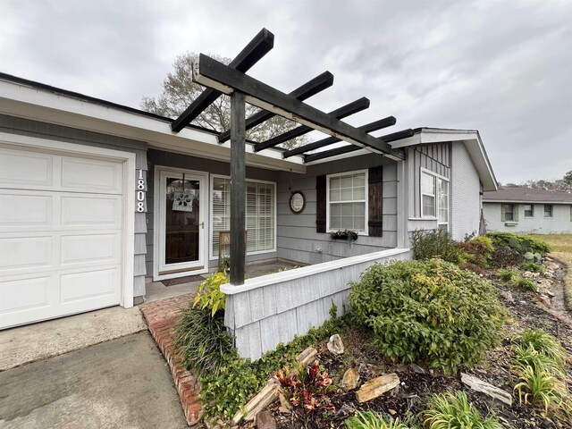 view of exterior entry with a garage